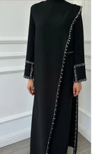 Shoma- A timeless Black Abaya that goes beyond trends - Wrap yourself in dignity, beauty, and meaning - The elegance of simplicity. The comfort of tradition. ABAYA ONLINE