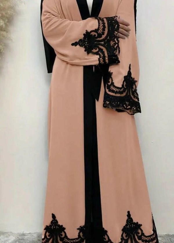 WOMAN WEARING PINK AND BLACK ABAYA 2025